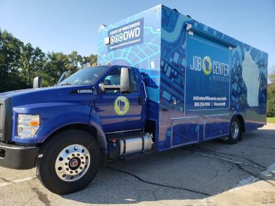 Photo of job seekers visiting the Mobile Career Lab (front view)
